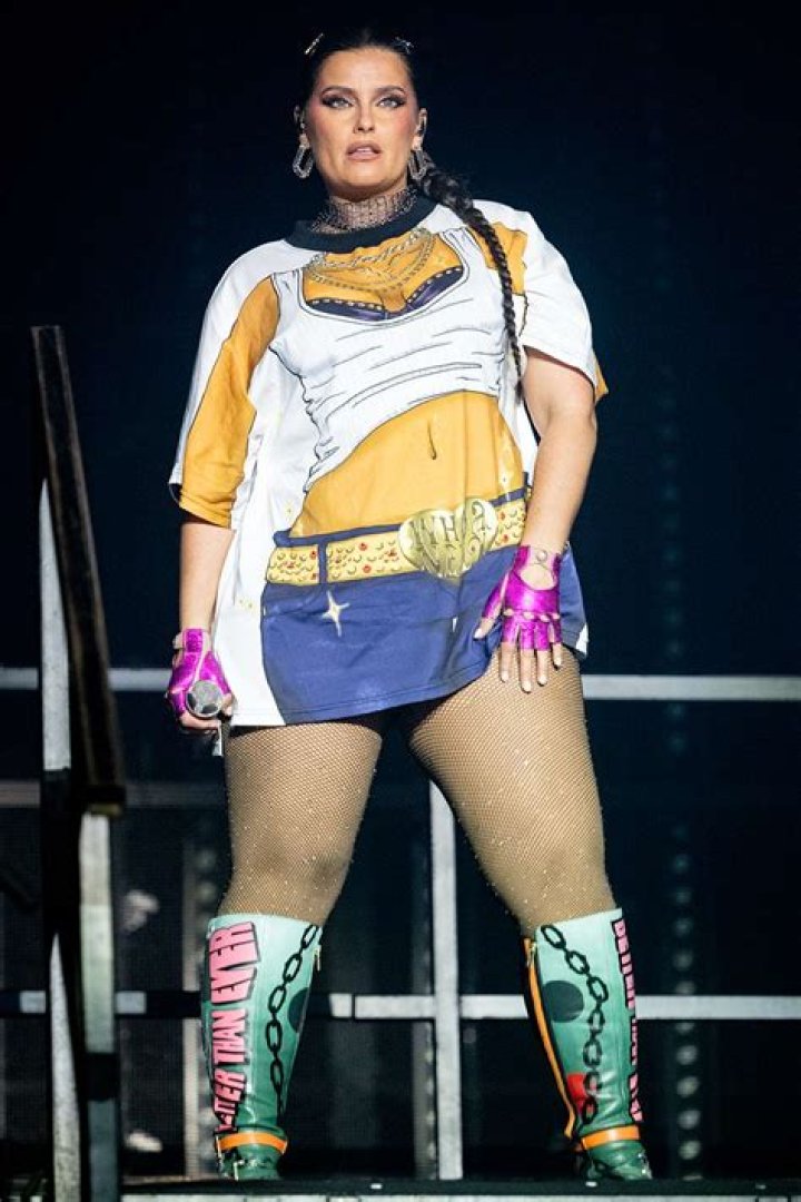 What is the meaning of give it to me Nelly Furtado?